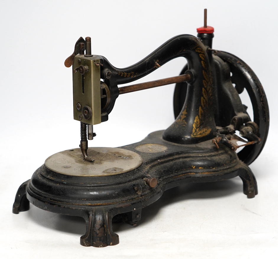 A late 19th century Jones swan neck sewing machine with a cast iron base, gilt decorated frame and stamps including; ‘As supplied to HRH the Princess of Wales’. Condition - fair